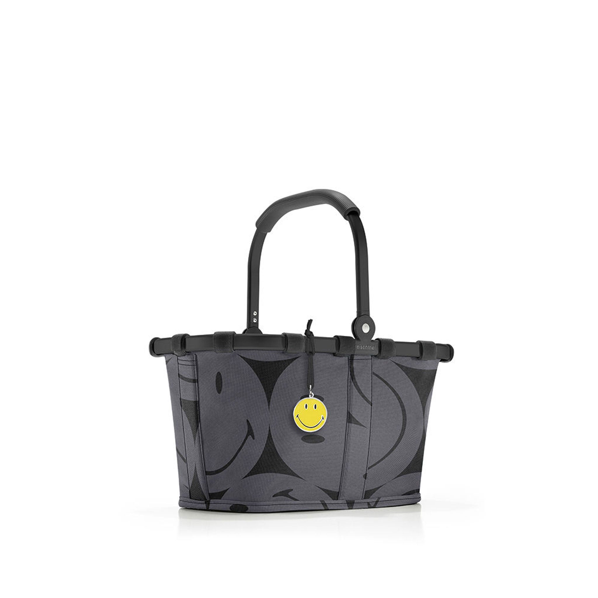 Carrybag Smiley XS grey von reisenthel in Frontansicht mit Smiley Motiv und gelbem Anhänger